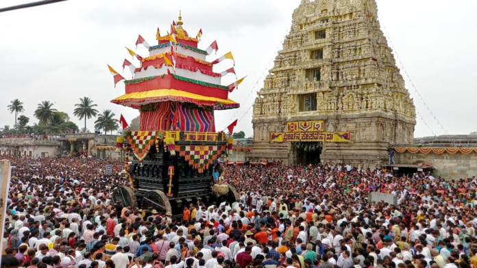 Devotees attend the rathotsava (chariot or car festival) at the historic Chennakeshava temple in Belur, Hassan district of Karnataka on April 13, 2022. (Image Credit: HT/Prakash Hassan)
