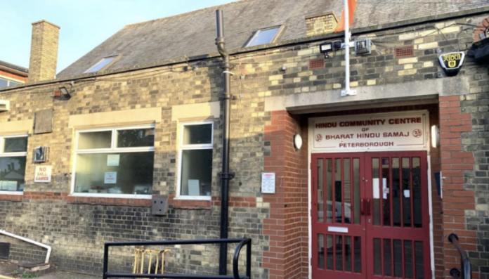 Hindu community centre building with sign 