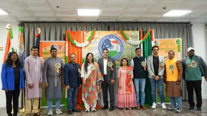 Group photo of diverse community members celebrating cultural pride at Sacramento IAS meet and greet.