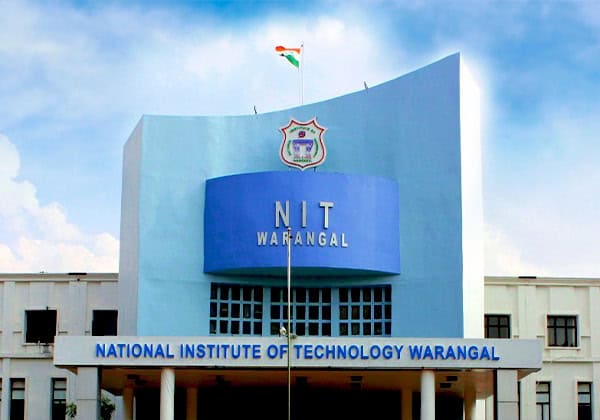 NIT Warangal campus building with Indian flag, related to Hanuman Chalisa recitation controversy.