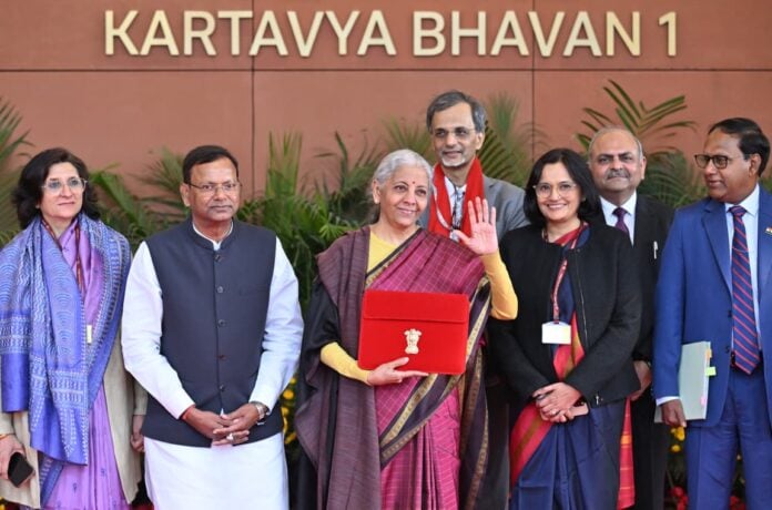 Indian government officials at Kartavya Bhavan during a formal event.