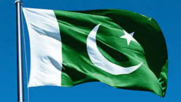 Pakistani flag flying high, symbolizing national pride and sovereignty.