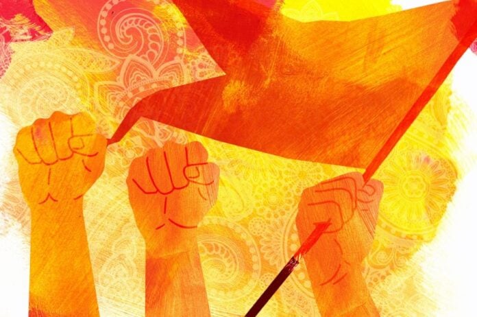 Hindu protestors holding flags in a demonstration, symbolizing cultural pride.