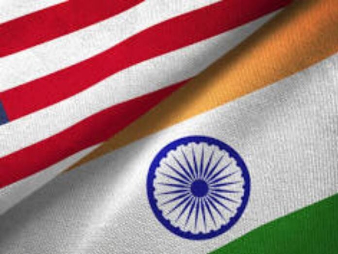 Close-up of Indian and American flags symbolizing trade negotiations and diplomatic relations.