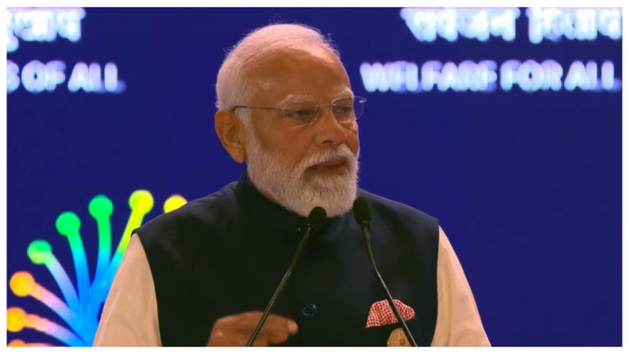 PM Modi speaking at AI and welfare conference on MANAV AI initiative.