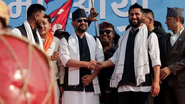 Nepal political leaders celebrating election victory, symbolizing generational change.