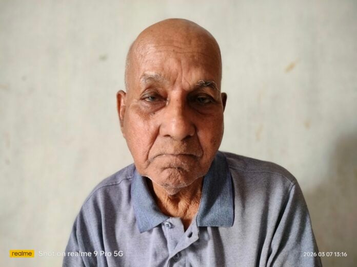 Elderly man with serious expression, symbolizing unsung hero in Bangladesh's history.