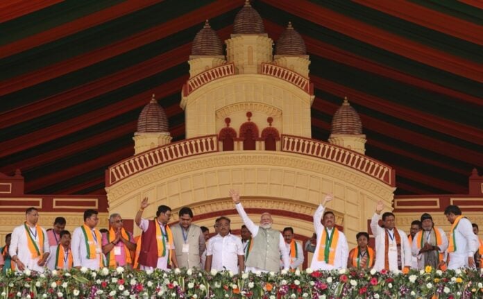 BJP leaders and supporters at Kolkata's Brigade rally during Modi's speech, showcasing political str.