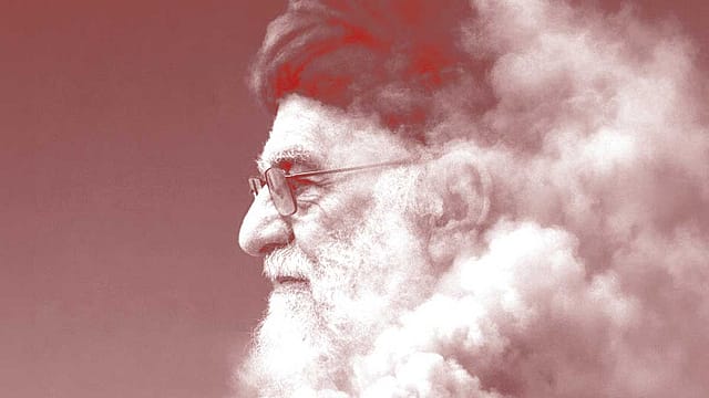 A spiritual leader with a beard and glasses during the Rites of Freedom in Tehran.