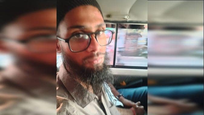 Image of Ayan Javed, linked to Islamic terror gang, in vehicle, related to investigation.
