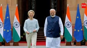 India and France leaders engaging in a discussion during a diplomatic meeting.