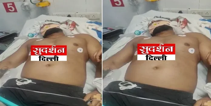 Injured man lying on hospital bed after attack in Delhi, violence and religious tension.