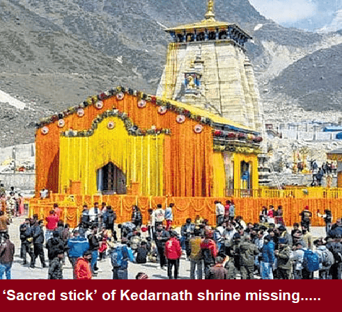 Crowd gathers at Kedarnath shrine with decorated temple, sacred sceptre missing, inquiry ordered.