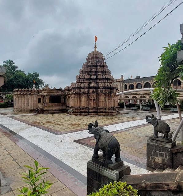 Hindu temple with elephant statues, traditional architecture, and spiritual ambiance.