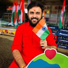 Nikhil Chandwani holding Indian flag during rally supporting Hindu community in Pakistan.
