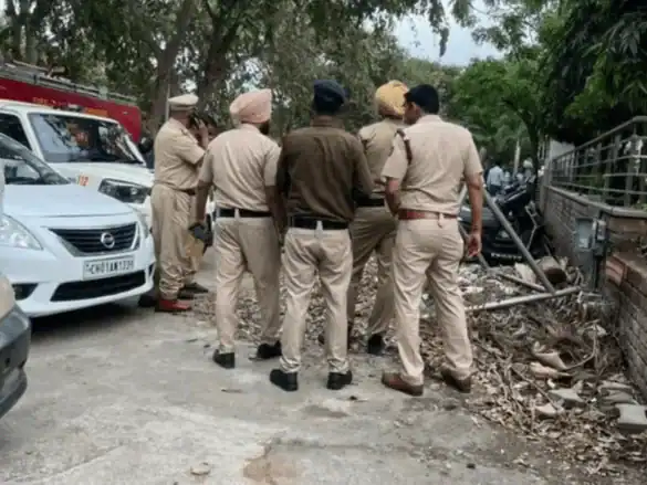 Police officers investigate grenade attack site in Chandigarh.