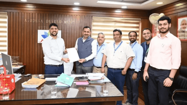 Group of officials and architects discussing the Ayodhya temple museum project and map approval.