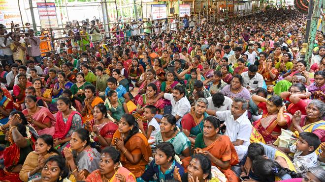 Devotees celebrating a vibrant celestial wedding ceremony at Meenakshi Sundareswarar Temple during a.