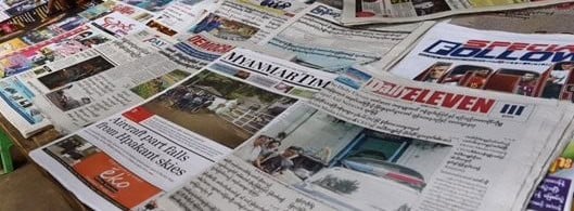 Close-up of newspapers and newsprint, Indian news media, current affairs, print journalism.
