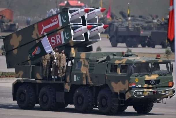 Pakistani military parade showcasing missile launchers and soldiers.