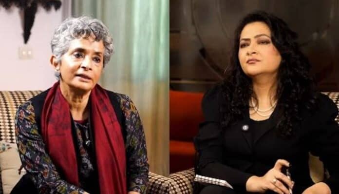 Two women engaged in a discussion, highlighting Hindu culture and women's roles.