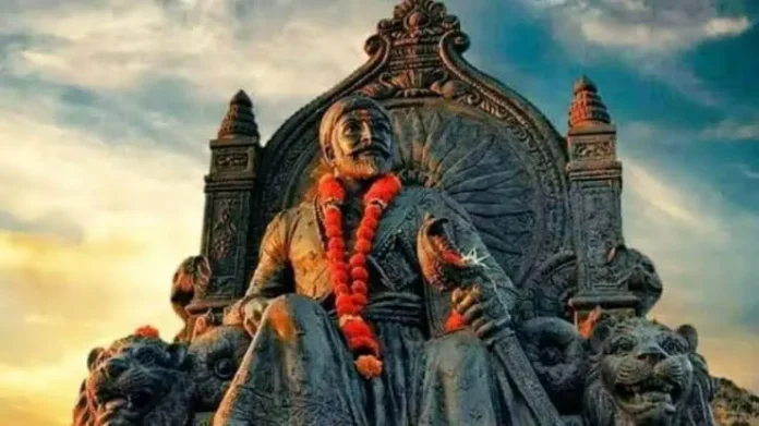 Majestic statue of Shivaji Maharaj with a sunset background and traditional attire.