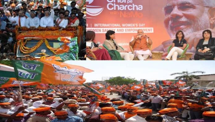 Large gathering of supporters at a political rally with Narendra Modi and banners.